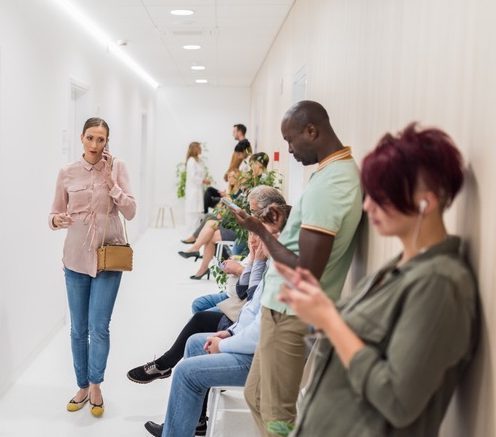 people standing in line in a waiting room